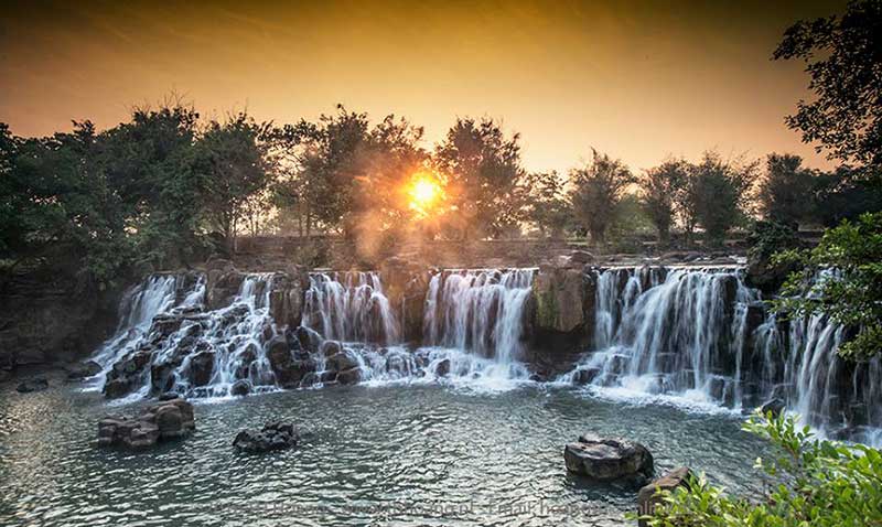 Giang Dien Waterfall, Dong Nai, Vietnam view from above with long exposure  photography makes the water smooth as silk. It attracts tourists weekend  resort Stock Photo